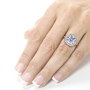 Cushion Cut 3 carat moissanite engagement ring in hand