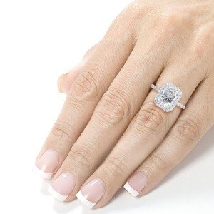 Radiant-cut 3 carat moissanite engagement ring in hand